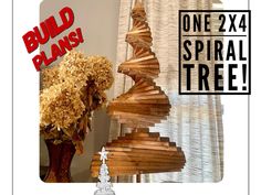 a christmas tree made out of wood sticks with the words build plans on it and an image of a pine tree