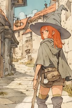 a woman in a witch costume is walking down the street