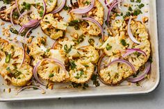 a tray filled with roasted cauliflower and onions