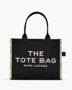 The Large Tote, crafted in our most deluxe woven jacquard, is a go-to carryall that's ready for an overnight, a plane ride or a day at the office. The Large Tote features a chunky top zip closure, woven namesake branding. multiple inside pockets, sturdy top handles and room for anything you might need. Carry yours by the top handles or wear over your shoulder. Part of THE™ collection. | MARC JACOBS The Jacquard Large Tote Bag in Black Marc Jacobs Logo, Marc Jacobs Tote, Craft Tote Bag, White Tote Bag, White Tote, Marc Jacobs Bag, The Tote Bag, Medium Tote, Black Tote