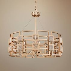 a wooden chandelier hanging from a ceiling