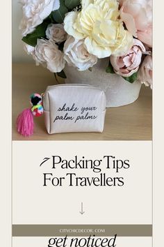 a white vase filled with pink and white flowers next to a small bag that says packing tips for travelers