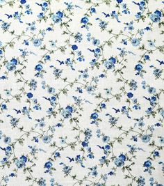 blue flowers on white fabric with green leaves