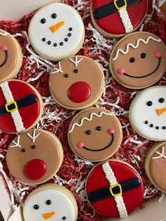 decorated cookies in a box with santa clause and snowmen