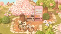 a bicycle parked next to a vending machine in a garden with flowers and trees