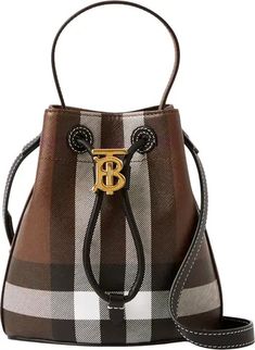 Free shipping and returns on Burberry Mini Check Coated Canvas & Leather Bucket Bag at Nordstrom.com. <p>Founder Thomas Burberry's polished monogram cinches the drawstring closure on this coated-canvas and leather bucket bag—the newest addition to the TB line.</p> Canvas Bucket Bag, Burberry Trench Coat, Metal Accessories