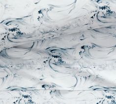 white and blue marbled paper with black swirls