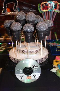 cake pops are arranged on top of a cd