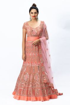 Coral pink anarkali with hand embroidered motifs and pleated hem. Comes with a sheer embroidered dupatta and churidar.
Component: 3
Pattern: Embroidered
Neckline: Leaf neck
Sleeve Type: Half sleeves
Fabric: Organza, Nokia Silk, Tulle
Color: Pink
Other Details: 
U-back
Pleated hem
Sheer dupatta
Embroidered motifs
Occasion: Bride, Wedding - Aza Fashions Sheer Dupatta, Pink Anarkali, Embroidered Leaf, Embroidered Anarkali, Embroidered Motifs, Embroidered Leaves, Silk Tulle, Embroidered Dupatta, Embroidered Neckline