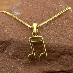 Semiquaver music note pendant in gold vermeil on gold chain. Perfect gift for the music lover in your life. We also have matching Stud Earrings and Silver Music Note Necklaces and Stud Earrings. View music range here:- https://www.etsy.com/uk/shop/RoyalMileSilver?.=undefined&section_id=37605442 * A high quality, unique product * Ethically traded sterling silver * Gold chain included, choice of lengths * Pendant weight: 1 grams * Gift boxed * Ships direct from Edinburgh, Scotland * Supports a small artisan business Vermeil is a technique originating in the 19th century, where gold is applied to sterling silver - making this a hypoallergenic product that can be worn without worry about the base metal being brass, copper or similar. We have created this to offer an affordable range of designs Music-themed Yellow Gold Jewelry Gift, Music Note Jewelry, Music Note Necklace, Music Notes, Edinburgh, Gold Vermeil, Gold Chains, Jewelry Set, Silver Gold