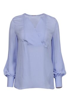 Look the part at your office shindig with this Elie Tahari lavender blouse. Crafted from 100% silk, this lightweight beauty features long sleeves and a flattering v neckline-- sophisticated never looked so good! Make a statement with precious pastels paired with ivory tailored pants, you're sure to be the talk of the town. Size XS 100% Silk Unlined Pullover V-neckline Long sleeves Bust 38" Waist 37.5" Shoulder to hem 26" Sleeve length 27.5"