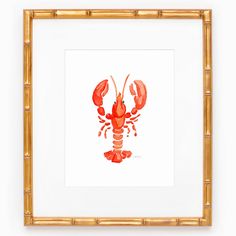 a painting of a lobster in watercolor on white paper with gold bamboo framed frame