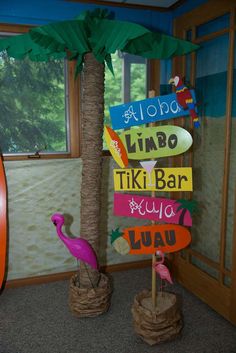 a palm tree and some signs in a room