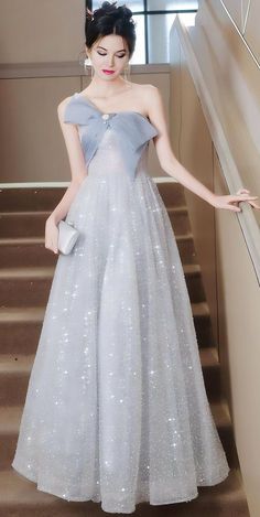 Discover the perfect outfit for your next special occasion with this elegant and shimmering light blue gown. Ideal for weddings, galas, and evening soirees, this dress features a dramatic bow and sparkling fabric that will make you stand out. Shop now  for a whimsical fairytale enchanted fairy fantasy ball experience. Keywords: evening gown, special occasion dress, elegant dress, wedding outfit, gala dress, formal gown, party dress, light blue dress. Elegant Sleeveless Ball Gown For Banquet, Prom Season Ball Gown For Banquets, Ball Gown For Banquet During Prom Season, Prom Season Ball Gown For Banquet, Tulle Evening Dress For Prom Season Banquet, Tulle Evening Dress For Prom Banquet, Sweetheart Neckline Ball Gown For Prom Evening, Elegant Tulle Evening Dress For Prom, Sleeveless Ball Gown For Evening Dress And Prom Season