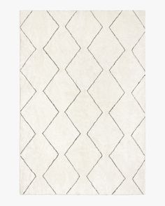 a white rug with black lines on it