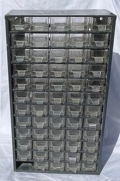 a large plastic storage cabinet with lots of clear bins on the top and bottom