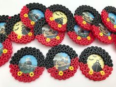 some red and black buttons with pictures on them