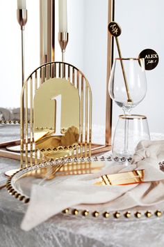 a table topped with gold and white decorations