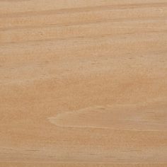 a bird standing on top of a wooden surface