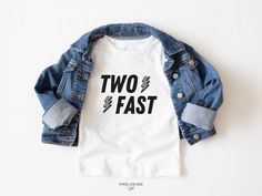 Introducing our super cool Two Fast birthday t-shirts, for a boys' race car theme party. These shirts are high quality and made with 100% soft ringspun cotton for very comfortable wear.   HOW TO ORDER 1. Select the color and size/name from the drop-down menu and add it to the cart 2. Repeat the process if you want to order more shirts 3. If you want a custom shirt, please select that from the menu and add the name to the personalization box NB: We have multiple options for Mom and Dad in the lis 2 Fast 2 Curious Birthday Outfit, Two Fast 2 Curious Birthday Party Boy, Two Fast Birthday Shirt, Two Boy Birthday Theme, Two Fast Birthday Theme, Two Fast Two Curious Birthday Party Boy, Too Fast Birthday Party, Two Year Old Birthday Party Boy, Second Birthday Boy Themes