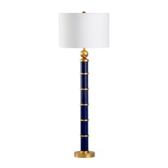 a blue and gold floor lamp with a white shade on the top one light is turned on