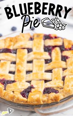 a blueberry pie with latticed crust sitting on a table