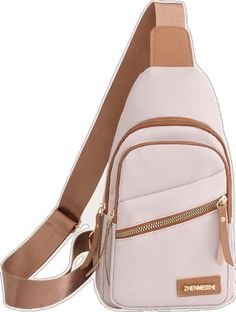 a white cross body bag with a tan strap and zippers on the front pocket