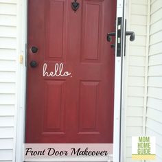 a red front door with the words hello written on it