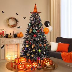 a decorated christmas tree in the corner of a living room with halloween decorations on it