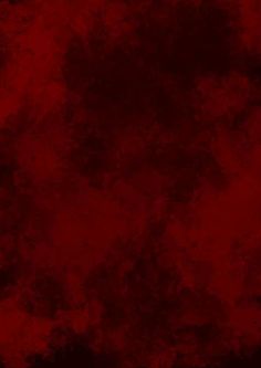 an abstract red background with black spots