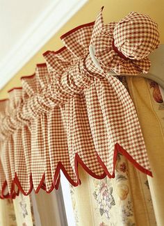 red and white checkered bow valance hanging from the side of a window