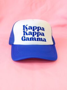 a blue and white cap with the words kappa kappa garnna on it