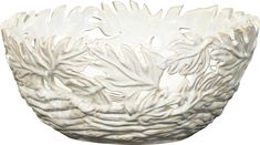 a white bowl with large leaves on the rim and bottom, sitting in front of a white background