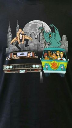 the back of a black t - shirt with an image of two cars and one man