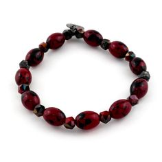 Add a subtle hint of your favorite team to your bracelet stack. The Chase bracelet features maroon and black beads. Wear alone or pair with an Erimish bracelet stack Stretch beaded bracelet Please be aware that due to the unique and handmade nature of each product, colors, shapes, and bead sizes may vary slightly from the photos and descriptions. Bracelets are 'one size fits most' and are designed to fit wrists up to 7.5" comfortably. Lead & Nickel Free Adjustable Burgundy Round Bead Bracelets, Casual Red Beaded Bracelets With Black Beads, Casual Red Bracelets With Spacer Beads, Erimish Bracelets, Bar Card, Bead Sizes, The Chase, Bar Bracelets, Bead Bracelets