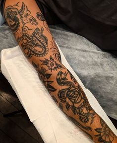 a man's arm with tattoos on it