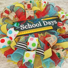 the school days wreath is decorated with colorful ribbons