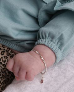 Precious sterling silver bracelet with gorgeous white freshwater rice pearls. This is a dainty timeless keepsake! Each bracelet has an extension chain, so as the child grows you just move to the next link for a perfect fit. This bracelet is available in three sizes and is great for infants, babies, toddlers, and kids. This jewelry comes in a beautiful gift box and is hand made in the USA! Celebrate these cherished moments with this keepsake she will treasure forever. Make it extra special by add Silver Baby Bracelet, Gold Neck Chain, Silver Pearl Bracelet, Bracelet For Girls, Rice Pearls, Baby Pearls, Kids Bracelets, Baby Bracelet, Hand Bracelet