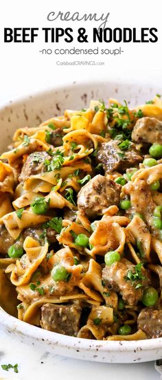 a white bowl filled with beef and noodles