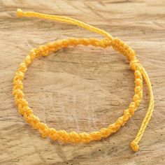 Whether you wear it alone or mix it with other bracelets, this macrame wristband is a fun casual accessory. Carmina Giron in Guatemala crafts the adjustable bracelet from waxed polyester cord. Adjustable Macrame Braided Friendship Bracelets, Casual Macrame Friendship Bracelets, Casual Adjustable Yellow Bracelets, Casual Yellow Adjustable Bracelets, Adjustable Macrame Friendship Bracelets In Nylon Cord, Adjustable Yellow Macrame Jewelry, Casual Macrame Beaded Bracelets For Friendship, Yellow Macrame Bracelet As Gift, Adjustable Yellow Braided Bracelet