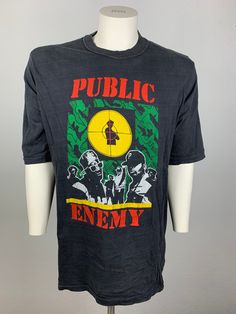 a black t - shirt with the words public enemy on it