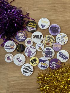 purple and gold confetti on wooden table next to party decorations