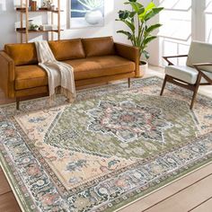 a living room filled with furniture and a rug