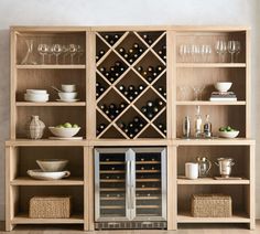 a wine rack filled with lots of bottles and glasses