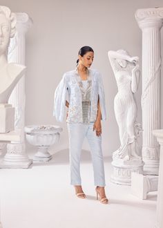 The Audrey Jacket Pant set is a 'bliss of summer air', with intricatly hand embroidered pearl detail with other fine materials all over the jacket and side seam of the pants. This ensemble has a 3D net detailing complimenting linear artwork perfectly juxtaposed together exhibiting impeccable couture craftsmanship. This outfit is a perfect fit to dance away the cocktail night or hit the reception party! Colour: Ice Melt Material: Opara- jacket, Opara- pants No of components: 3 Surface Ornamentation: Hand Embroidery Care Instructions: Dry Clean Shipping Time: 3-4 weeks Semi-stitched Sets With Pearl Embroidery For Wedding, Fitted Silk Sets With Pearl Embroidery, Festive Wedding Outerwear With Cutdana Detail, Bollywood Silk Pant Set With Embroidered Details, Hand Embellished Semi-stitched Silk Sets, Surface Ornamentation, Shirt Jacket Men, Cocktail Night, Drape Saree