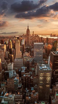 an aerial view of new york city at sunset