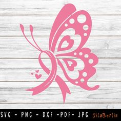 a pink butterfly with hearts on it's wings is sitting on a wooden surface