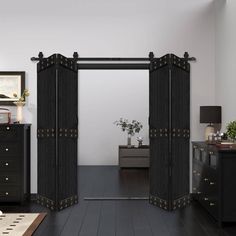 an open black door in a white room