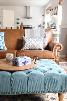 a living room filled with furniture and pillows