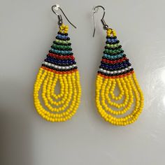 These Earrings Where Hand Made In Africa By The Zulu Tribe. Beautiful And Colorful. Traditional Yellow Beaded Earrings With Tiny Beads, Yellow Beaded Teardrop Earrings, Yellow Teardrop Beaded Earrings With Colorful Beads, Yellow Teardrop Beaded Earrings With Dangling Beads, Yellow Dangle Earrings With Large Beads, Yellow Large Beads Earrings For Festival, Yellow Large Beaded Earrings For Festivals, Adjustable Yellow Beaded Earrings With Large Beads, Yellow Earrings With Large Round Beads